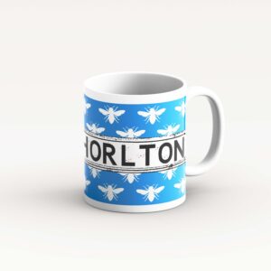 white bee on light blue mug
